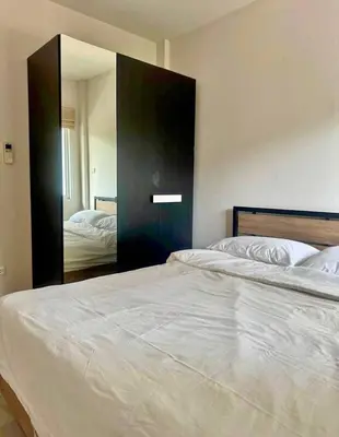 a bedroom with two beds and a large mirror at Дом у биг Будды in Ban Klang