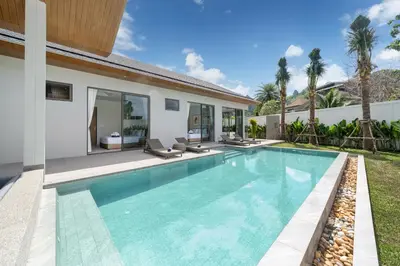 a swimming pool in the backyard of a villa at Himmapana Villas - Grand Valley in Kamala Beach