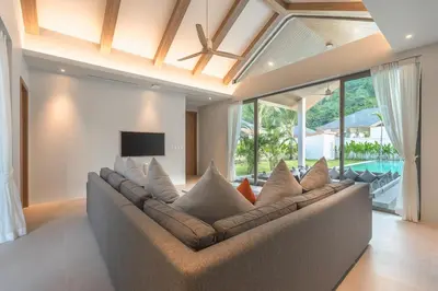 a large couch in a living room with a television at V157 Brand New Beautiful Dream Villa in Kamala Beach