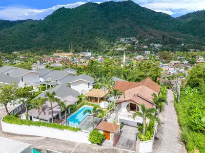 an aerial view of a house with a resort at kamala 1000 sqm new luxury 4 bedroom holiday pool villa extra large space amazing sunset in Kamala Beach