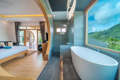 a bathroom with a tub and a bed and a window at kamala 1000 sqm new luxury 4 bedroom holiday pool villa extra large space amazing sunset in Kamala Beach