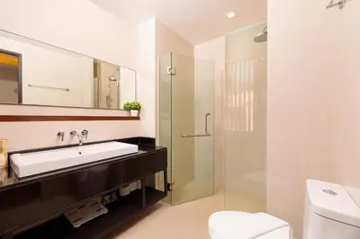 a bathroom with a sink and a shower at Spacious 3bd Townhouse in Laguna park in Laguna Phuket