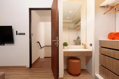a bathroom with a sink and a mirror at Spacious 3bd Townhouse in Laguna park in Laguna Phuket