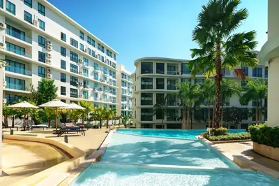a swimming pool in front of a building at Lovely studio 5 stars Hotel La Vita in Phuket Town