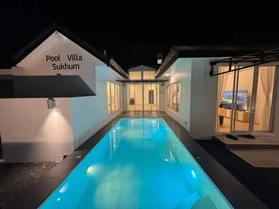 a swimming pool in a house at night at 4BR Pool Villa Sukhum in Phuket Town in Changwat Phuket