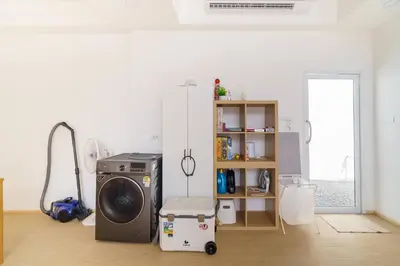 a room with a refrigerator and a washing machine at 4BR Pool Villa Sukhum in Phuket Town in Changwat Phuket