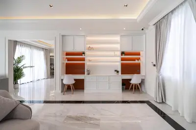 a living room with a kitchen with white cabinets at Fifth Element Pool Villas by NLA in Bang Tao Beach