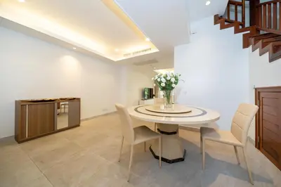 a dining room with a table and chairs at Angsana Laguna Phuket 2- bedroom, with pool access in Layan Beach