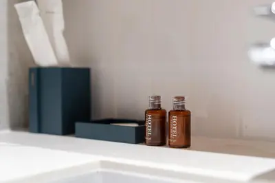 two bottles of honey sitting on a shelf at Laguna Beachside Residents in Phuket