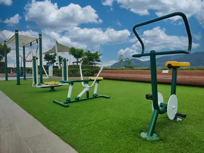 a row of exercise equipment in a park at 1BDR Laguna 10 min to the Sea Roof Pool in Laguna Phuket