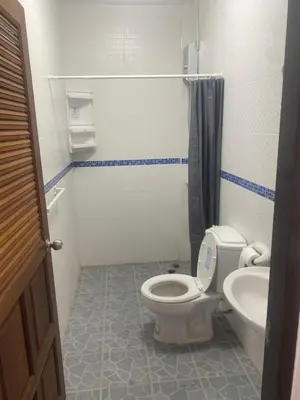 a small bathroom with a toilet and a sink at Da Puccio Rawai Guesthouse in Rawai Beach