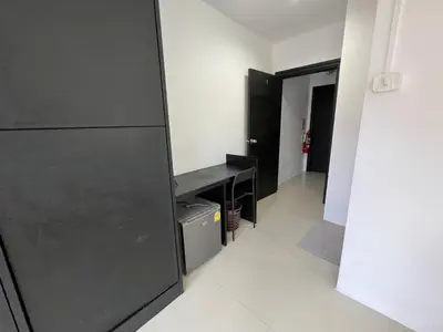 a room with a black desk and a hallway at Patong Easy life 5 in Patong Beach