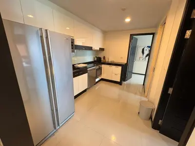 a kitchen with a stainless steel refrigerator at Modern 2-Bedroom Condo in Kamala Near the beach in Kamala Beach