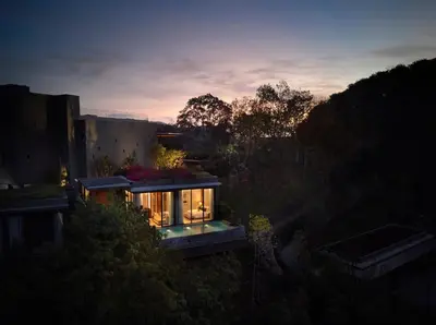 a house with lights on the side of it at Phuket V Building 19 Villas with Andaman Sea View Private Swimming Pool and Spa in Ban Ao Makham