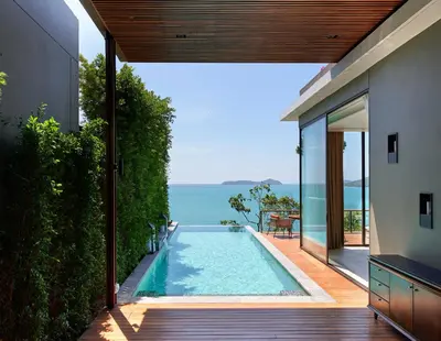 an infinity pool in a house with a view of the ocean at Phuket V Building 19 Villas with Andaman Sea View Private Swimming Pool and Spa in Ban Ao Makham
