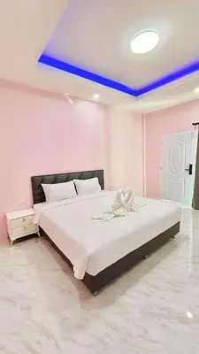 a bedroom with a large bed with a blue ceiling at The Saii in Ko Yao Yai
