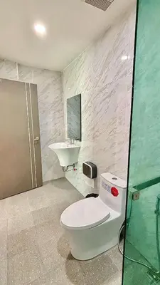 a bathroom with a toilet and a sink at The Saii in Ko Yao Yai