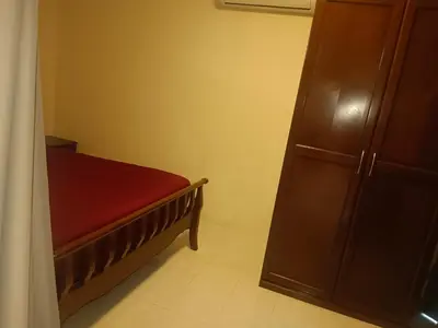 a small bedroom with a bed and a cabinet at Patong tower mountain view m705 in Patong Beach