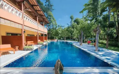 a swimming pool in a courtyard of a building at OYA International Resort Phuket \u666e\u5409\u5c9b\u6b27\u96c5\u56fd\u9645\u5ea6\u5047\u9152\u5e97 in Phuket Town