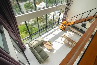 an overhead view of a living room with large windows at 650m to beach condofast WiFi in Kamala Beach