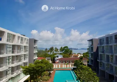 an image of a pool in the middle of two buildings at At Sea Condotel in Klong Muang Beach