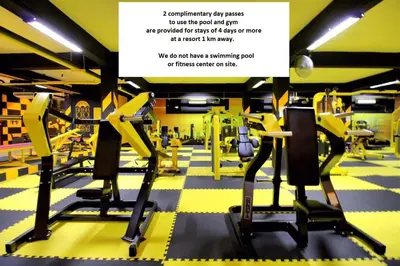 a gym with yellow and black treadmills at Songbird Suites - Deluxe Twin Suite and Scooter in Ao Nang Beach