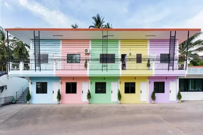 a building painted in different colors at Songbird Suites - Deluxe Twin Suite and Scooter in Ao Nang Beach