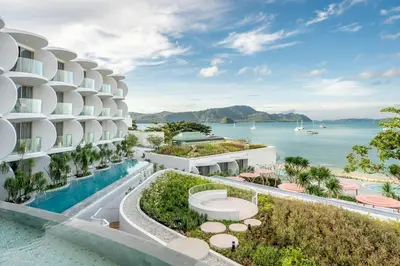 an exterior view of a building with a swimming pool at Veranda Resort Phuket, Autograph Collection in Panwa Beach