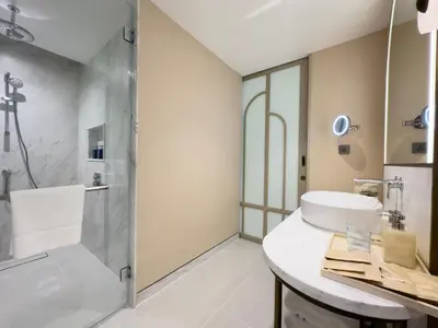 a bathroom with a sink and a shower at Veranda Resort Phuket, Autograph Collection in Panwa Beach