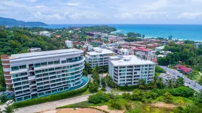 an aerial view of a city and the ocean at Veloche Apartment by Continent in Karon Beach