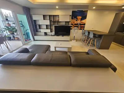 a living room with a couch and a television at C162 Sea View 8 Minuets to Patong Karon Butter Fly in Karon Beach