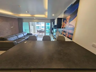a living room with a large table and a couch at C162 Sea View 8 Minuets to Patong Karon Butter Fly in Karon Beach