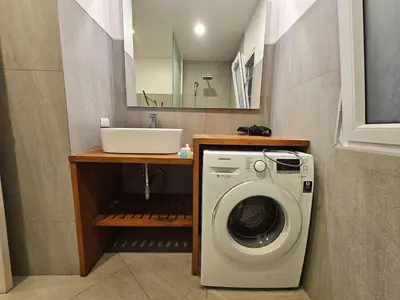 a bathroom with a washing machine and a sink at C162 Sea View 8 Minuets to Patong Karon Butter Fly in Karon Beach