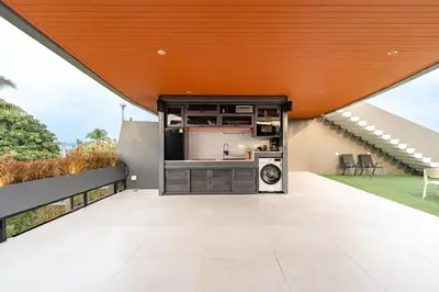 an outdoor kitchen with an orange roof on a house at V160 Beautiful Sea View Full Smart House 3BR in Rawai Beach
