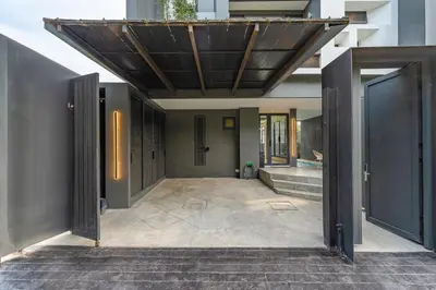 an open door of a building with awning and stairs at V160 Beautiful Sea View Full Smart House 3BR in Rawai Beach