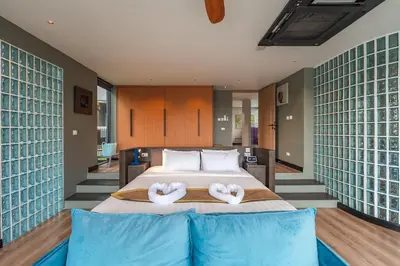 a bedroom with a bed with two heart shaped pillows at V160 Beautiful Sea View Full Smart House 3BR in Rawai Beach