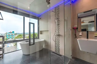a bathroom with a shower and a tub and a sink at V160 Beautiful Sea View Full Smart House 3BR in Rawai Beach