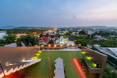 a group of white benches sitting on top of a building at V160 Beautiful Sea View Full Smart House 3BR in Rawai Beach