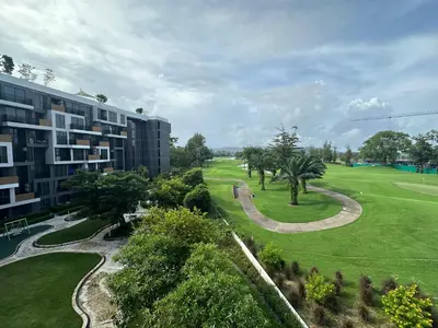 an aerial view of a building and a park at 1 BD Laguna Skypark Golf Course View in Phuket