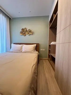 a small bedroom with a bed and a closet at 2 BD Laguna Skypark Condo in Phuket