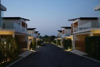 a car parked on a street between buildings at Zenithy Villas 3BD in Phuket