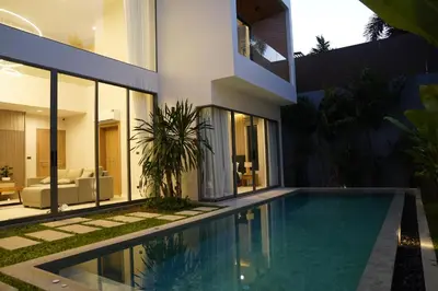 a house with a swimming pool in front of it at Zenithy Villas 3BD in Phuket