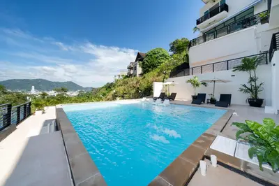 a swimming pool with a view of a building at Patong Cliff Villa Phuket 12 bedroom in Patong Beach