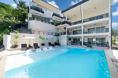 an image of a swimming pool in front of a building at Patong Cliff Villa Phuket 12 bedroom in Patong Beach
