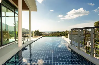 a swimming pool on the roof of a house at Amor Primero - sea view pool villa with maid in Kamala Beach