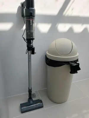 a camera on a tripod next to a trash can at 150 square meters 3BR with parking townhouse near golf course, UWC school, Nayang Beach, airport in Ban Muang Mai (1)