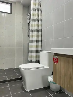 a bathroom with a toilet and a shower curtain at 150 square meters 3BR with parking townhouse near golf course, UWC school, Nayang Beach, airport in Ban Muang Mai (1)