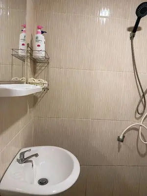 a bathroom with a sink and a shower at Friendly house in Ko Phlong