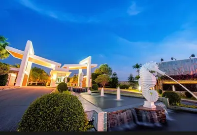 a large building with a statue in front of it at Chalong Miracle Lakeview in Chalong