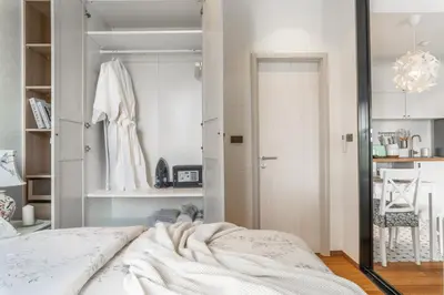 a bedroom with a bed and a closet at Title Halo Romantic Suite Pool View Gym in Nai Yang Beach